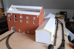 Buildings taking shape on Ben Powell's new industrial layout in foamcore board with slaters embossed plasticard skins. Image © Ben Powell
