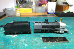 Alongside "Victoria" in the workshops was "Matilda", a second Roundhouse/MDC 2-8-2 being converted from HOn3 to 009. In addition to the brass chimney & re-gear kit fitted to "Victoria", "Matilda" is getting replacement crosshead castings and new rods cut from Nickel Silver sheet (the drilled blanks shown front right). It's intended that "Victoria" will also get these upgrades at a later date (when the cast crossheads can be obtained). Image © Julien Webb